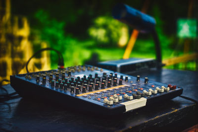 Close-up of sound mixer on table