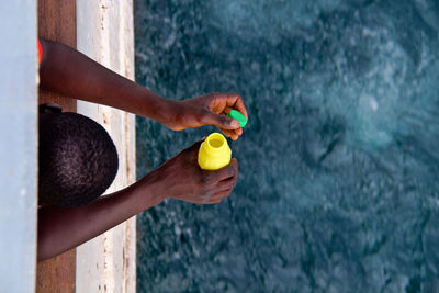 Close-up of man holding swimming pool