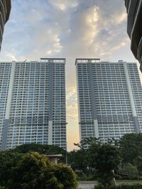 Low angle view of modern buildings against sky