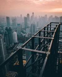 High angle view of construction site in city during sunset