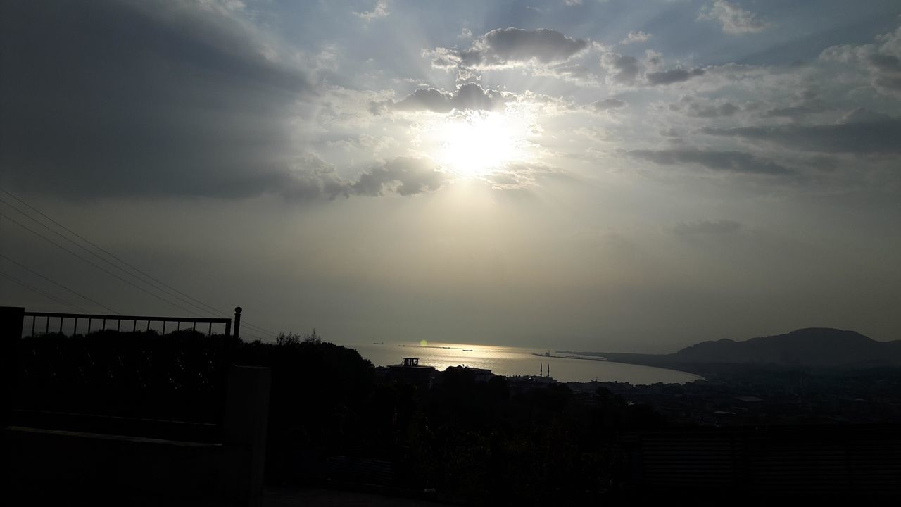 SCENIC VIEW OF SKY OVER MOUNTAINS AGAINST BRIGHT SUN