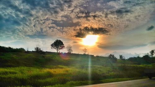 Scenic view of landscape against cloudy sky