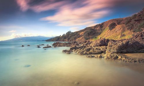 Scenic view of sea against cloudy sky