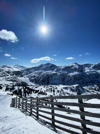 Scenic view of snow covered mountains against sky