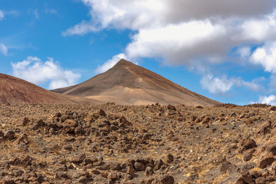 The dramatic scenery of lanzarote, its arid and rocky landscape and coastline.