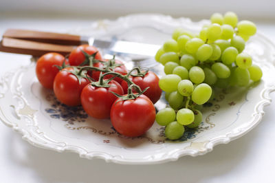 Close-up of fruits in plate on table