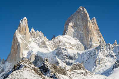 Panoramic view of snowcapped mountains against sky