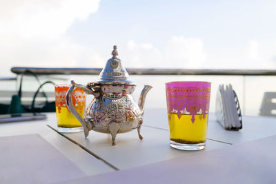 Moroccan tea with a tea cup against the clouds