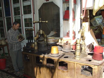 Side view of man preparing food in store