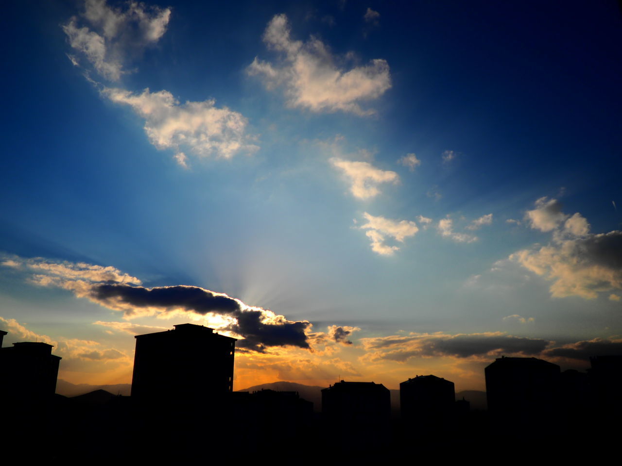 SILHOUETTE BUILDINGS AGAINST SKY AT SUNSET