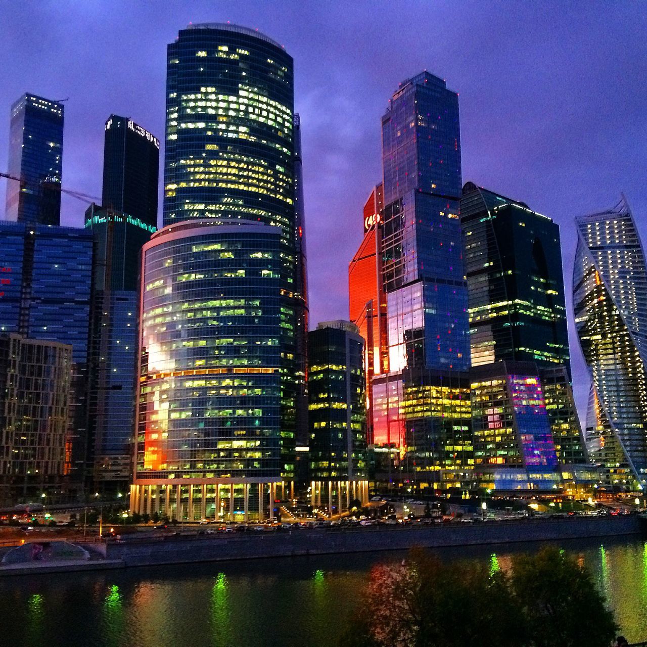 LOW ANGLE VIEW OF ILLUMINATED SKYSCRAPERS