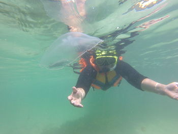 Woman swimming in sea