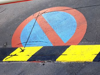 High angle view of arrow sign on road