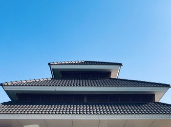 Low angle view of building against blue sky