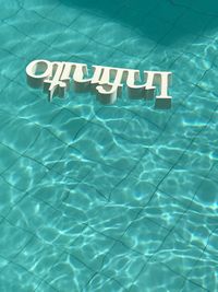 High angle view of text on swimming pool