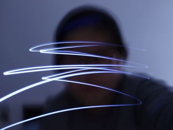 Close-up of male face with light trail