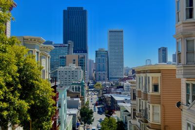 Cityscape against clear blue sky