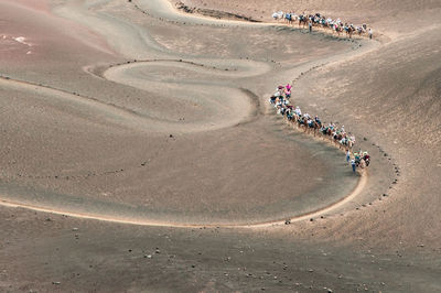 High angle view of people on sand