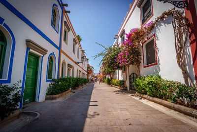 Alley amidst buildings in city