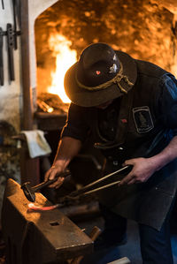 Man working on metal in workshop