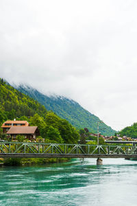 Bridge over river against sky