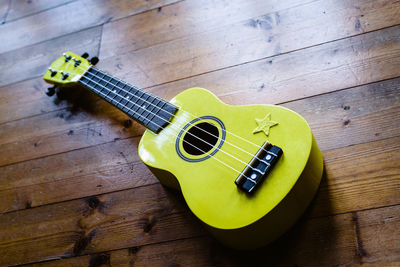 High angle view of guitar on table