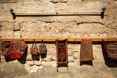 Clothes drying against wall