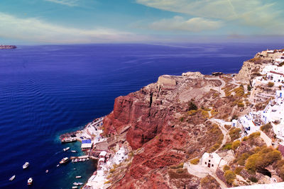 High angle view of sea and rock formations against sky