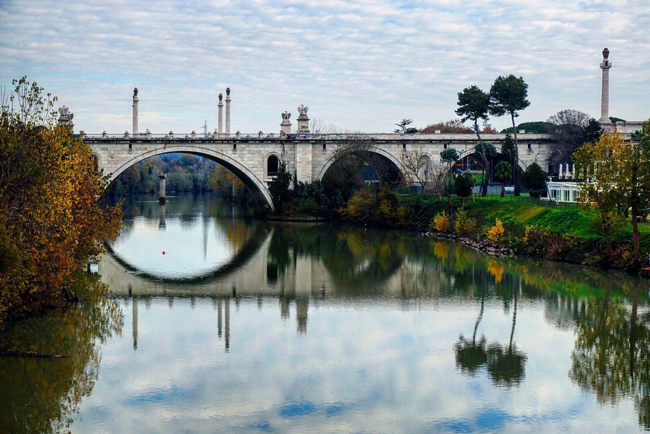 reflection, water, tree, sky, bridge - man made structure, lake, built structure, nature, outdoors, standing water, architecture, connection, no people, scenics, day, reflection lake