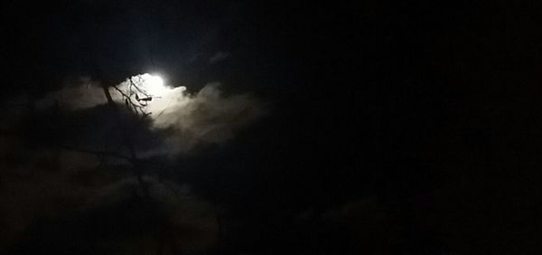 Low angle view of power lines against sky