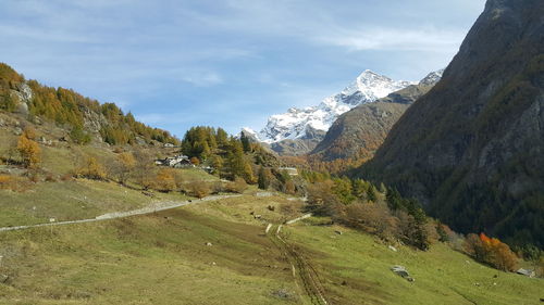 Scenic view of snowcapped mountains against sky