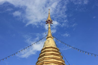 Low angle view of traditional building against blue sky