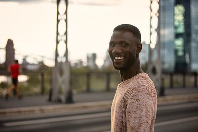 Portrait of young man standing outdoors