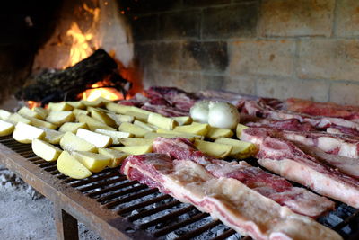 Close-up of meat on barbecue grill