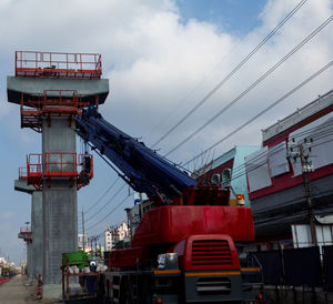 Low angle view of red ship against sky