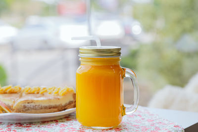 Close-up of drink in glass jar on table