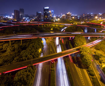 High angle view of light trails on road at night