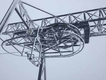 Chairlift riding out a blizzard at the top of a sierra nevada mountain 
