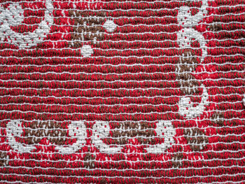 Detail of embroidered textured red cloth