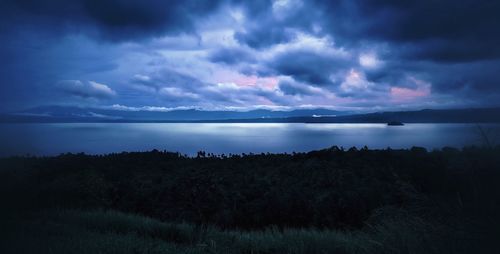 Scenic view of sea against dramatic sky