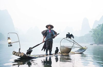 Scenic view of people in water