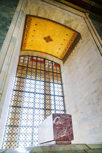 Low angle view of ornate window in building