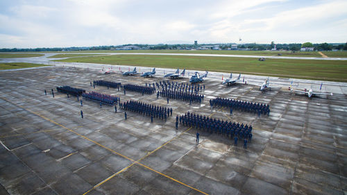 High angle view of empty chairs on landscape against sky