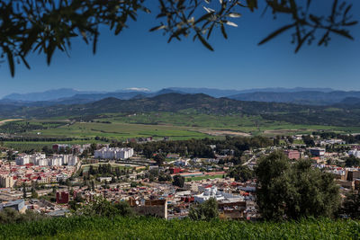 Aerial view of townscape against sky