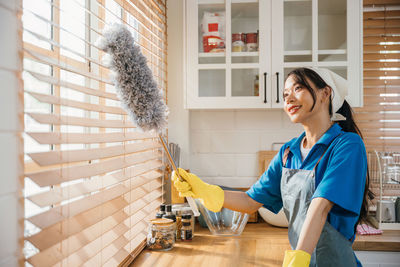 Portrait of young woman working at home