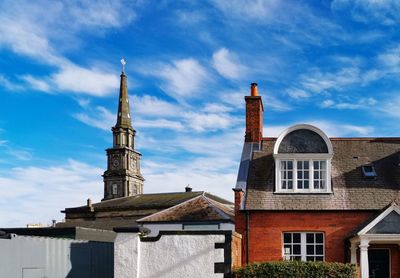 Low angle view of building against blue sky