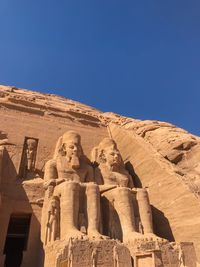 Low angle view of statue against sky