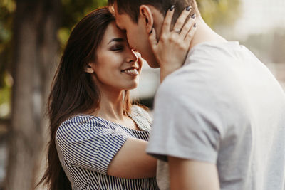 Couple cuddling in city