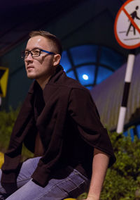 Portrait of young man looking away