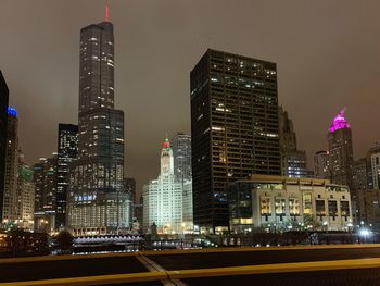 Illuminated buildings in city at night